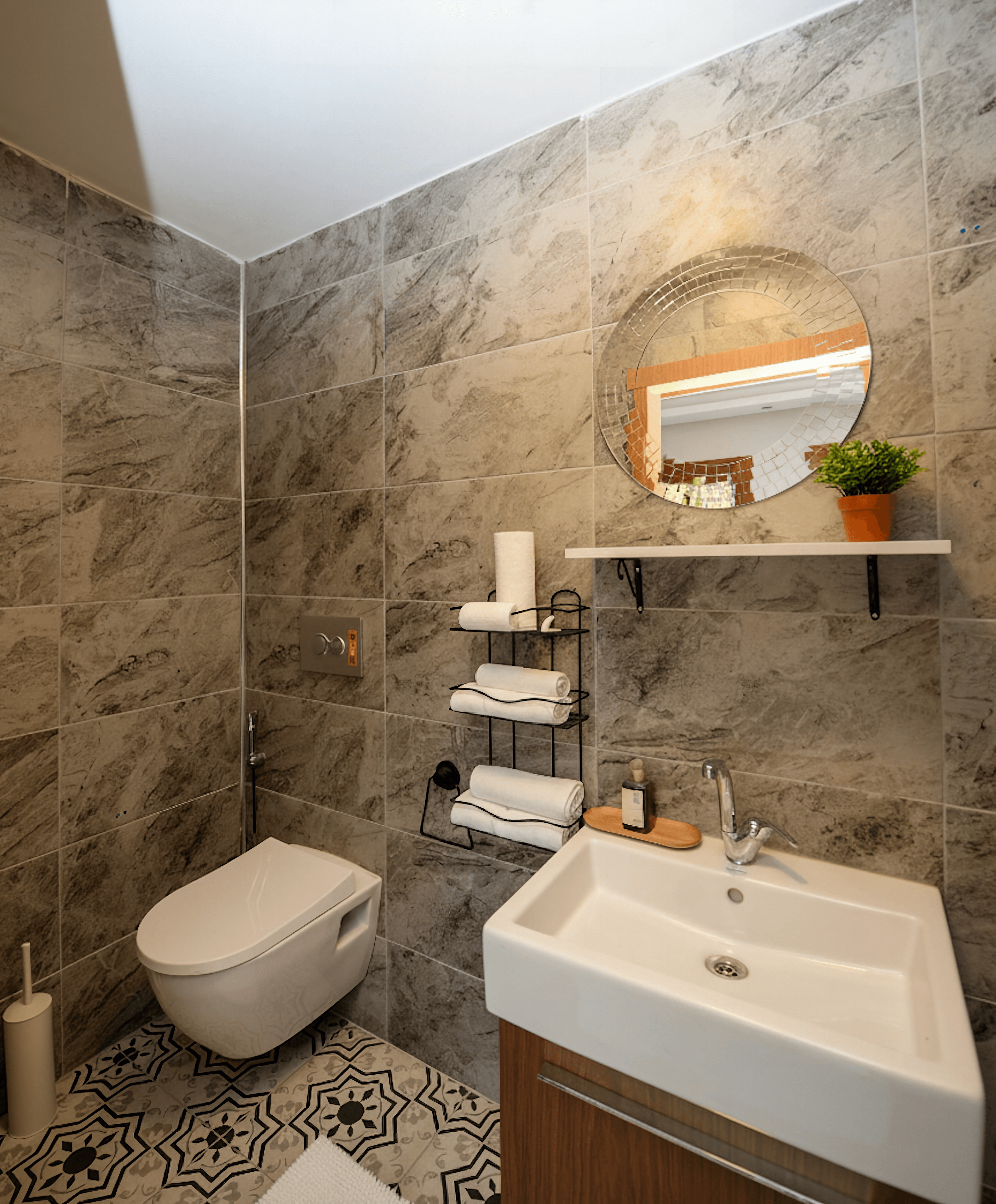 Marble bathroom with mosaic mirror and towel shelf